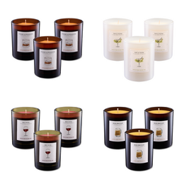 Scented candles, cylindrical glass jars, black and cream colored, four different scents, luxury home fragrance set.