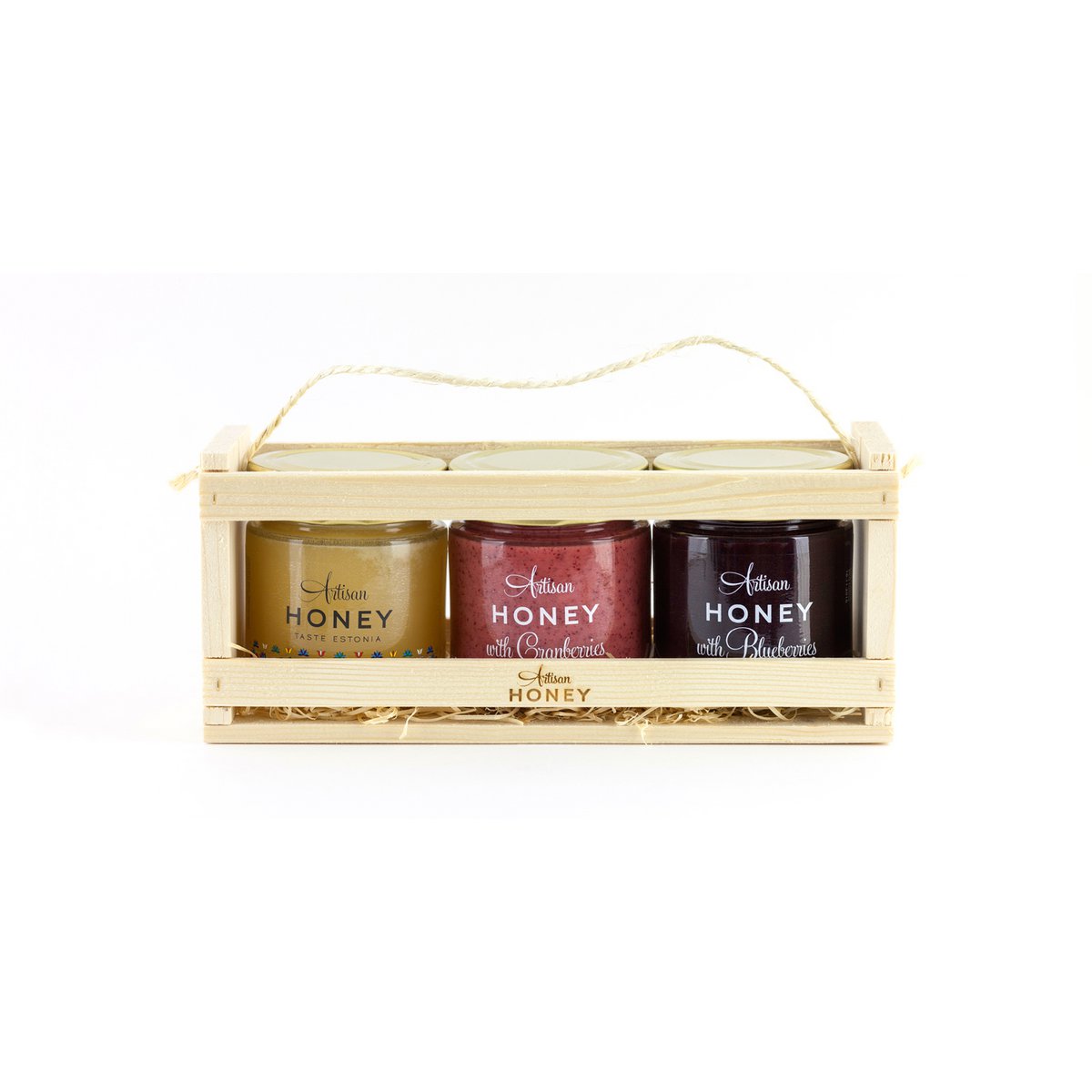 Bloesemhoning en twee smaken in een houten geschenkdoos