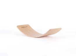 Wooden balance board for kids, designed for exploration and play. Features a curved shape and "Capikooa" branding.