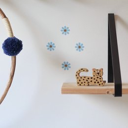 Wall sticker with daisies in white and ice blue colors, suitable for decorating a kids room. The sticker features a simple, minimalist design with floral elements.