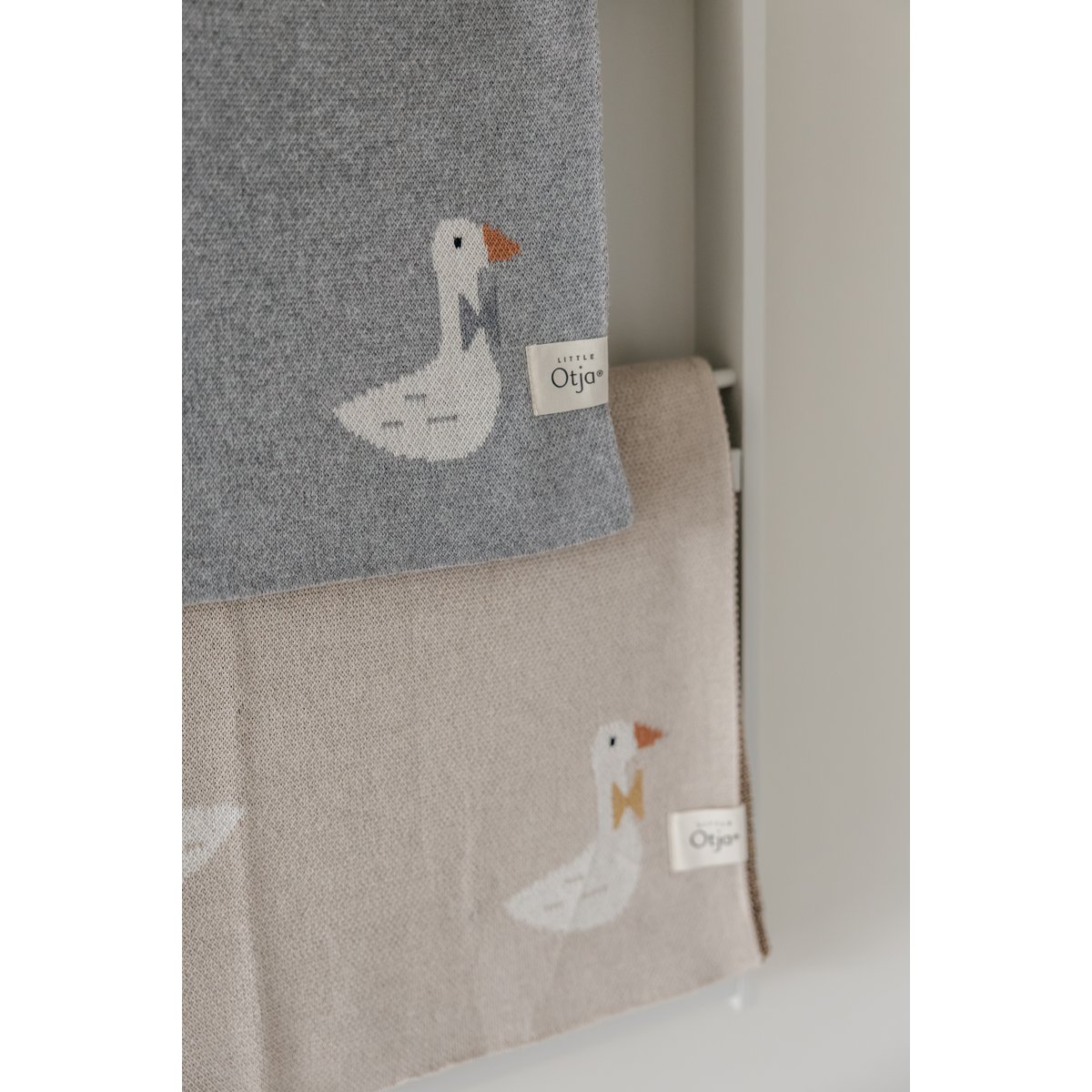 Gebreide katoenen babydeken, beige ganzen