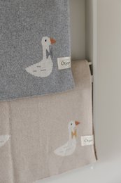 Gebreide katoenen babydeken, beige ganzen