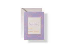 A purple and white striped greeting card with the text "Sending Love" printed on the front.