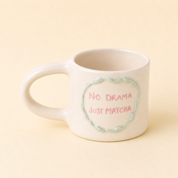 Cream ceramic matcha mug with "No Drama Just Matcha" text, circular design, handmade, 450ml capacity, Spain-made.