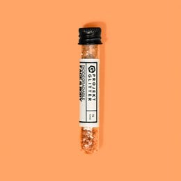 Butterscotch-colored face makeup with a shimmery, glittery texture.