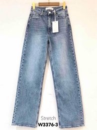 Blue denim straight leg jeans, high waist, classic five-pocket style, medium wash.
