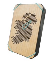 Wooden statue of Ireland in various colors including cherry, anthracite, blue, green, petrol, purple, and red. The statue has a unique perforated design that creates a dotted pattern.