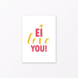 A postcard with the text "Ei (I) love you!" in colorful lettering. The postcard has a simple, minimalist design with a white background.