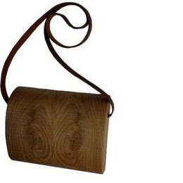 Rough sawn oak handbag with a unique, natural wood grain pattern and a long, adjustable strap for versatile wear.