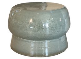 A round, tall stool with a grey-blue glaze finish.