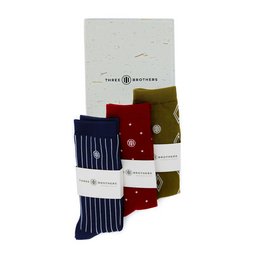 Colorful patterned socks in navy blue, red, and olive green. The socks feature a variety of geometric and polka dot designs, suitable for casual or formal wear.