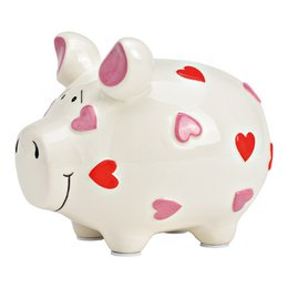 A ceramic piggy bank in the shape of a pig, with a white body and pink and red heart-shaped patterns. The piggy bank is a decorative storage item for holding coins or other small items.
