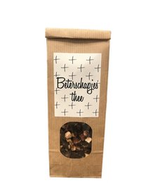 A box of herbal tea labeled "Biotherapy tea" with a paper bag-style packaging and a window showing the tea leaves inside.
