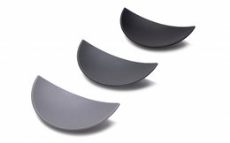 Sleek, modern jewelry box with curved, semi-circular compartments in a dark gray color.