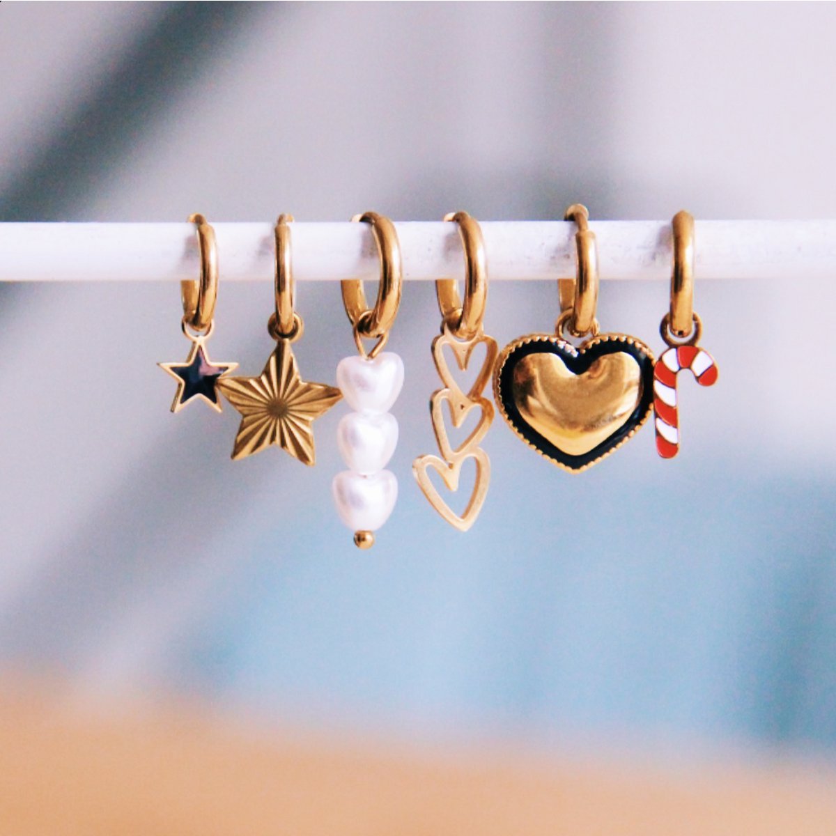 Aros de acero inoxidable con 3 perlas de corazón - oro