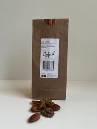 Low carb unsalted nut mix in a brown paper bag. Contains a variety of nuts including almonds, cashews, and pecans.