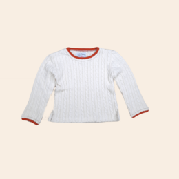 A white cable knit sweater with red trim, suitable for girls. The sweater has a classic, cozy style and is available in sizes 92 to 122.