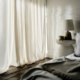 Beige curtain panel, 140cm x 280cm, made of a soft, lightweight material that creates a cozy, relaxing atmosphere in the room.