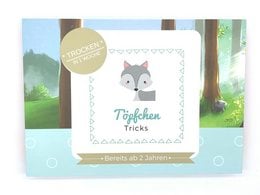 Potty training kit for children featuring a gray fox character. Includes a potty training guide and stickers.
