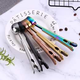 Stainless steel tea/coffee spoon with closing clip, available in 5 colors: silver, gold, rose gold, rainbow, and black.