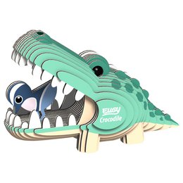 A 3D DIY craft kit in the shape of a crocodile, featuring a green and blue color scheme, with a large open mouth and sharp teeth. The kit includes pieces to assemble the crocodile model.