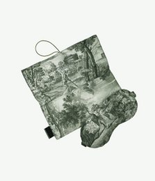  Grey travel sleeping mask with a soft, plush fabric case. The mask features a floral and leaf pattern design.