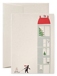 Greeting card featuring a man pulling a sled with a winter scene in the background. Suitable for friendship or winter-themed occasions.