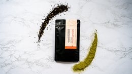 A black and white tea package with the text "Matchai Blend" on it. The package appears to be made of a durable material and has an orange accent color.