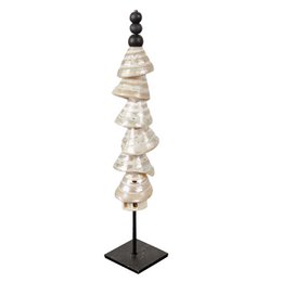 Tall, stacked shell tower with pearl accents on a black metal stand. Decorative statue with natural, organic shapes and textures.