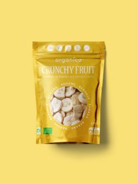 Dried banana slices in a yellow package. The banana slices are round and golden in color, with a crunchy texture.