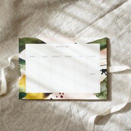 A5 weekly planner with floral colors and design elements.