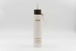 Intense Tonic PO/1 is a toner for dark or light hair. The product is packaged in a white bottle with a black cap.