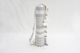 Fringed yoga bag in white and gray colors, made of soft, durable material with a striped pattern and tasseled ends.
