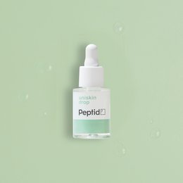 White bottle with green label and dropper, labeled "Uniskin Peptid". Skincare product for face.