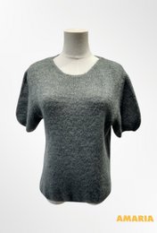 Short sleeve round neck sweater in beige, white, blue, brown, fuchsia, gray, jeans, dark red, and pine green colors. Made of alpaca wool blend material with a soft, textured knit.