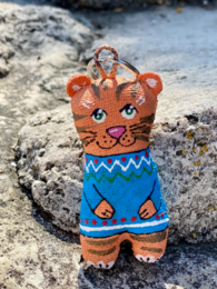 Tiger cub keychain with blue sweater, knitted fabric, cute animal design, orange and blue colors