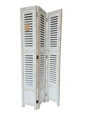 White wooden decorative shutter with louvered design, suitable for home decor.