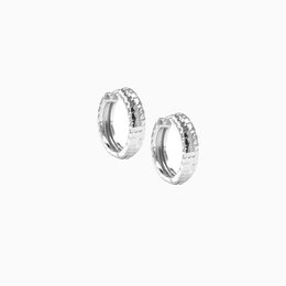 Hammered silver huggie hoop earrings, 17mm in diameter, with a textured surface for a unique and stylish look.