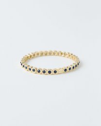 Gold beaded bracelet with black and blue stones, elastic stretch band, elegant beaded design