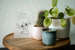 Greeting card featuring a black and white illustration of the Disney character Stitch from the movie Lilo & Stitch. The card has the text "Lilo & Stitch" printed on it.
