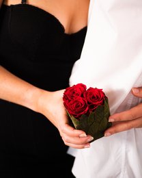 Preserved red roses in a heart-shaped box, perfect for Valentine's Day.