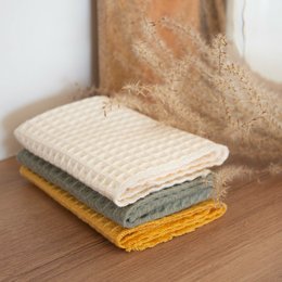 Set of 6 washable paper towels in ecru, mustard, khaki, and gray colors. Absorbent and reusable cleaning cloths.