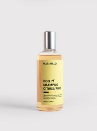 Dog shampoo with citrus and pine scents, suitable for pet hair care.