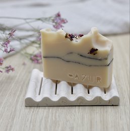 Decorative soap tray made of ribbed marble and sandstone, with a wavy design. Suitable for holding and displaying soap bars.
