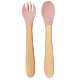  A set of pink and wooden cutlery for kids, including a fork and spoon. The cutlery has a simple, minimalist design with a pink silicone grip and a natural wooden handle.