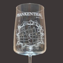 Tall, round wine glass with a map of the city of Frankenthal etched onto the glass.