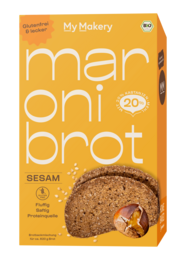 Gluten-free chestnut bread baking mix with sesame seeds, round loaf shape, brown color.