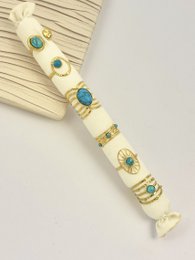 Conjunto de 6 anillos de piedra turquesa dorado en acero inoxidable con cojín ofrecido