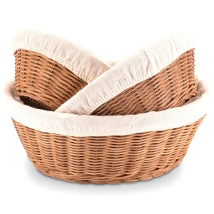 Set made of 3 bread baskets from rattan braided with a linen cloth