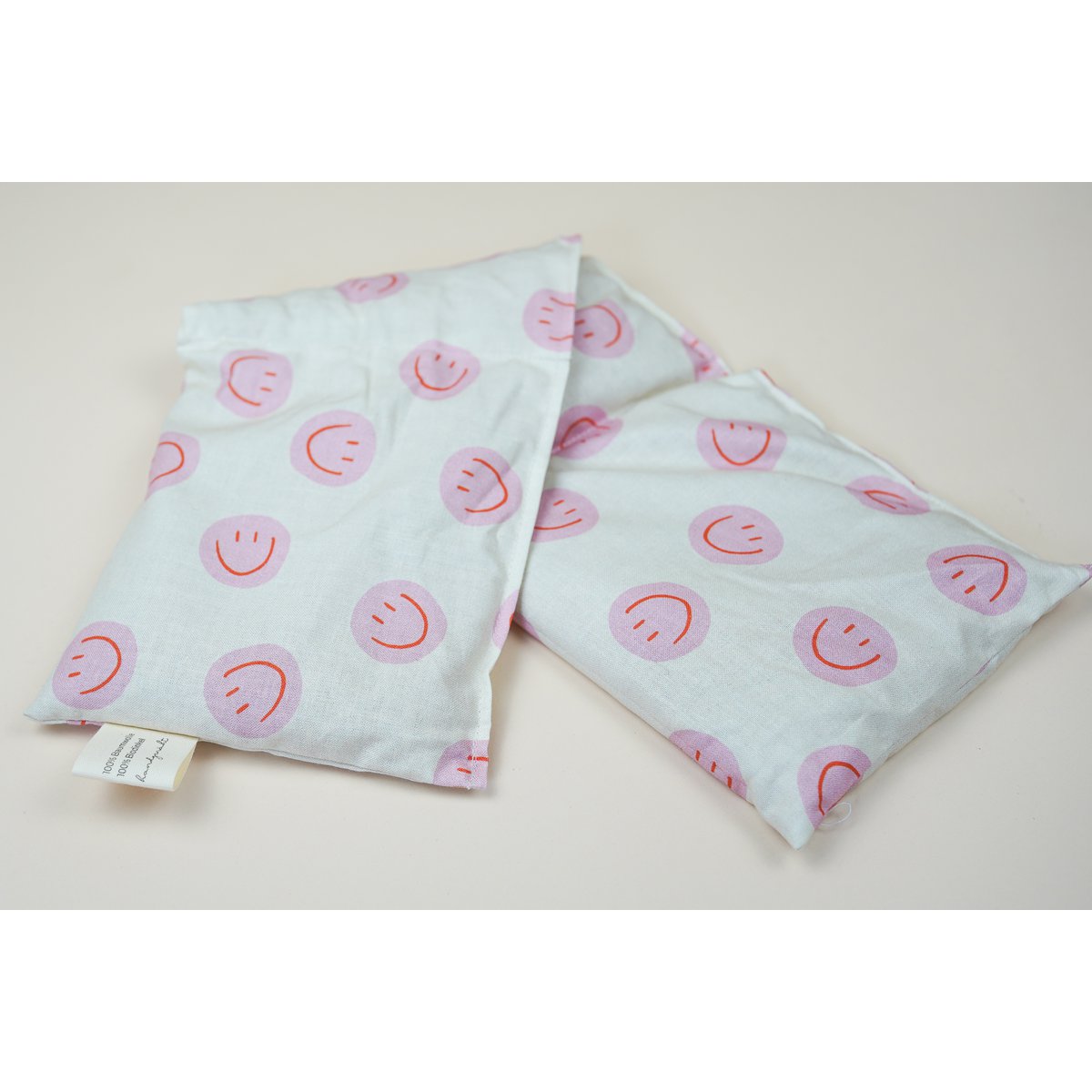 Katoenen warmtekussen gevuld met biologische spelt Smiley Pink